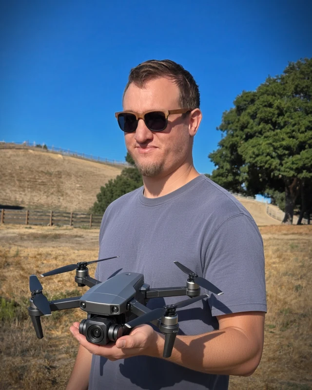 Landon Hoemke, FAA Part 107 certified drone pilot, holding a Stoop 360 drone