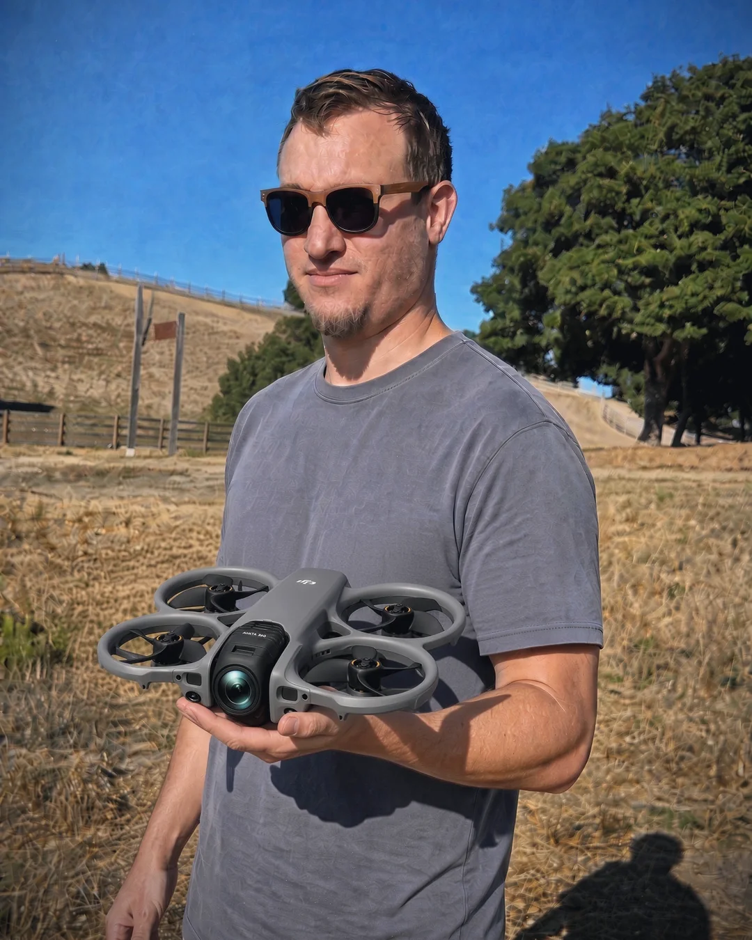 Landon Hoemke, FAA Part 107 certified drone pilot, holding a DJI Avata 360